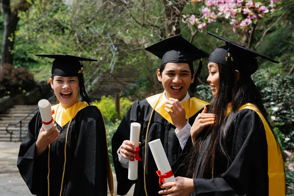 Happy students celebrating A-Level graduation success
