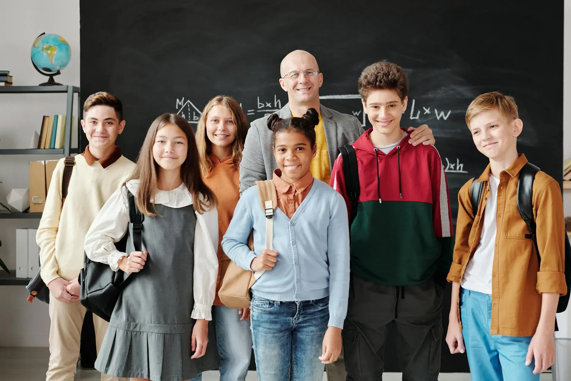 Diverse students learning with teacher guidance during tutoring session